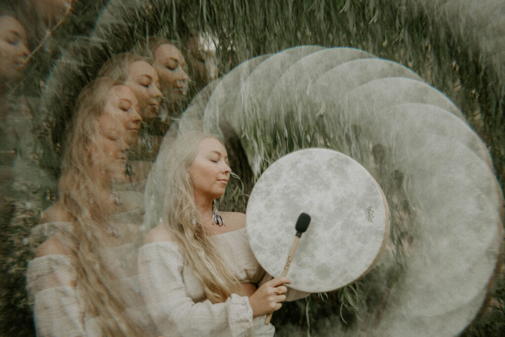 Spiritual healer playing the drum