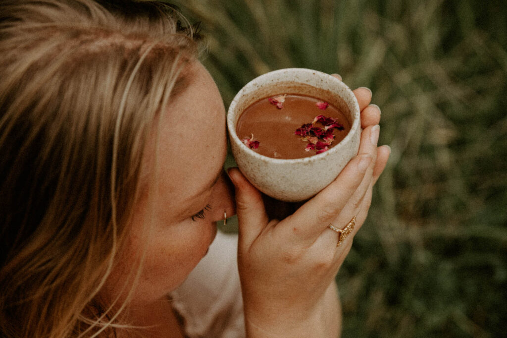 woman holding cacao in a cup